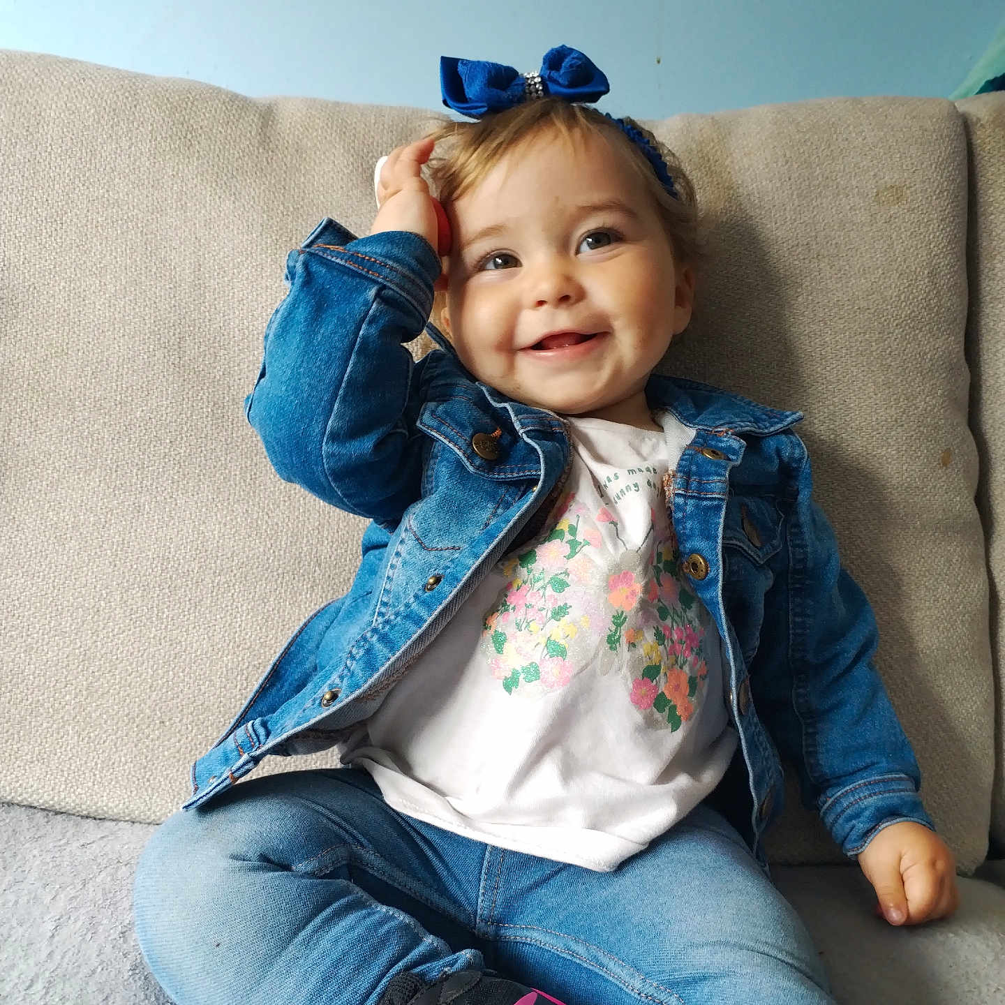 Skylar is registered to the contest to win money with this photo: child, clothing, coat, couch, cushion, face, female, footwear, furniture, girl, happy, head, homedecor, jacket, jeans, pants, person, photography, portrait, shoe