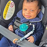 Mason is registered to the contest to win money with this photo: baby, blue_outfit, car_interior, car_seat, child, clothing, cute, hair, hand, infant, pacifier, pacifier_clip, person, portrait, safety, seat, seat_belt, skin, smile, warning_label