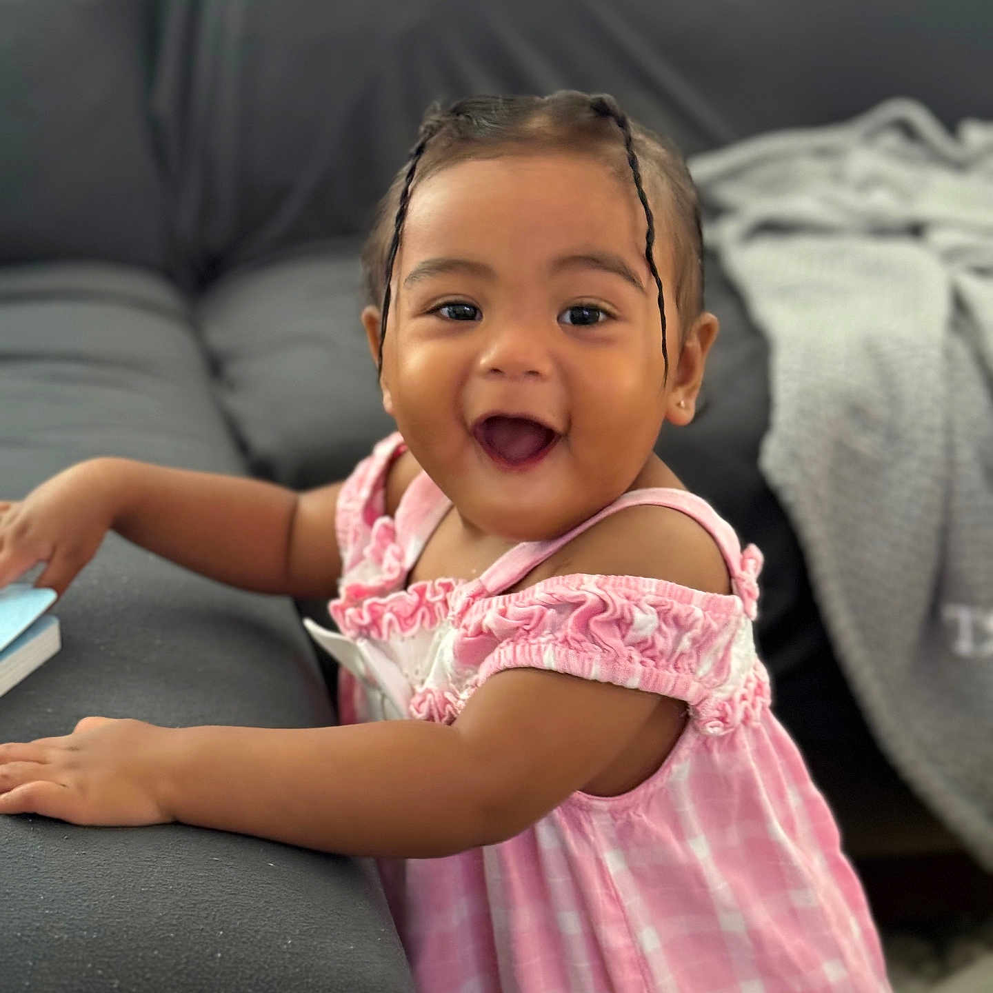 Makayla joined the competition — help win amazing prizes! baby, babylaughing, child, clothing, couch, cushion, dress, face, female, furniture, girl, happy, head, homedecor, laughing, person, photography, portrait, sitting, smile