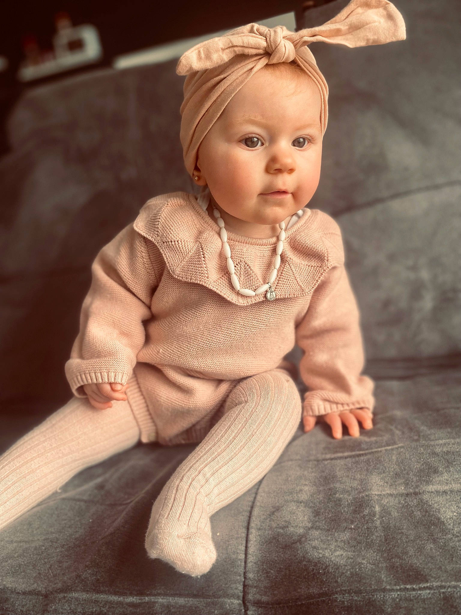 Giulianna participe au concours pour gagner de l'argent avec cette photo : baby_toddler_clothing, cheek, chin, doll, dress, eye, eyebrow, eyelash, fawn, flash_photography, flooring, head, human_body, iris, jewellery, person, sitting, skin, sleeve, toy
