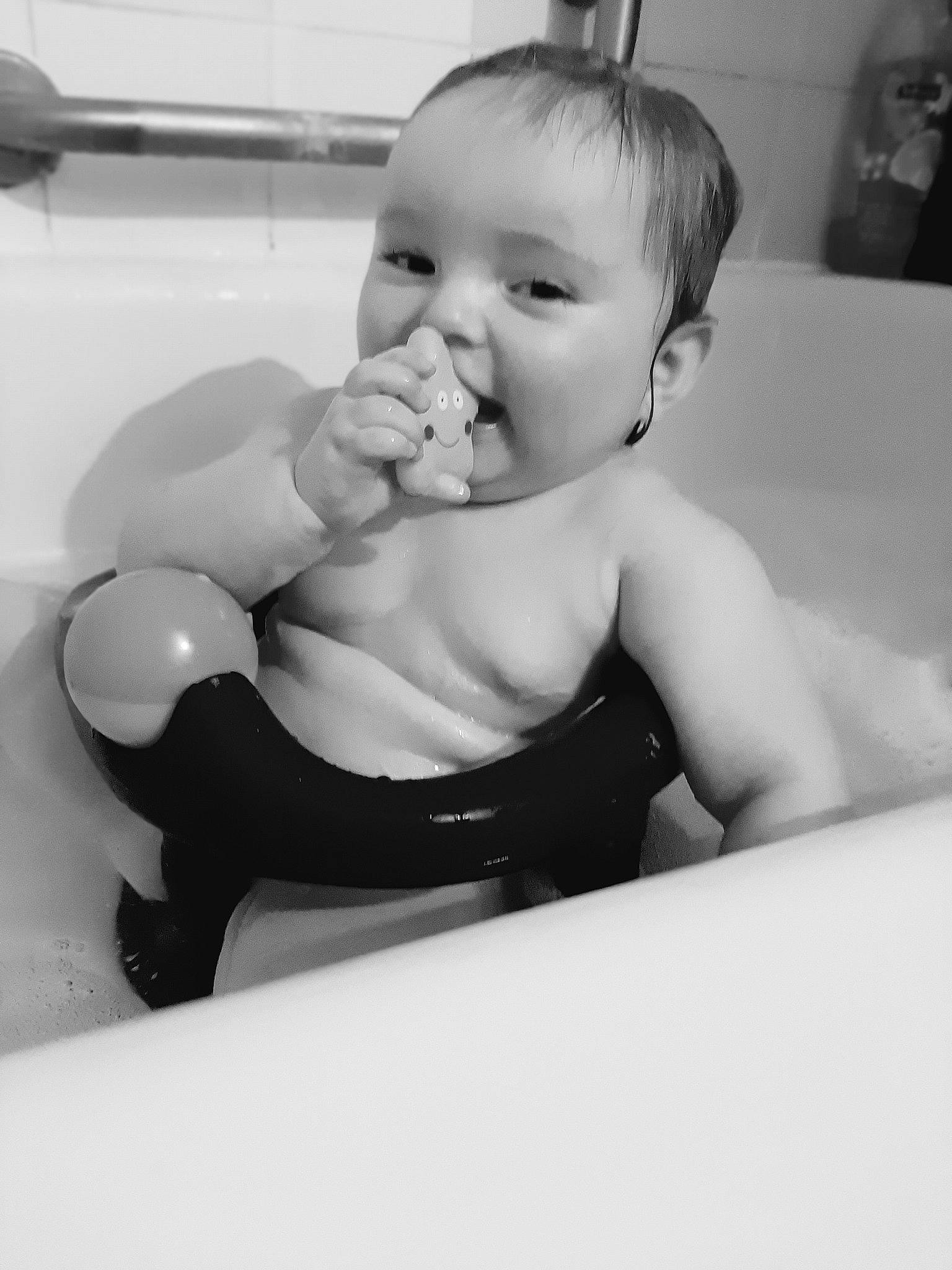 Amara joined the competition — help win amazing prizes! baby, baby_products, bathing, black_and_white, cheek, chest, child, elbow, finger, fun, gesture, happy, monochrome, monochrome_photography, mouth, person, photo_caption, room, sitting, thumb