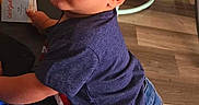 Eric joined the competition — help win amazing prizes! child, toddler, baby, portrait, standing, looking_at_camera, curious, serious_expression, indoors, playroom, toys, activity_center, furniture, couch, wood_floor, denim, jeans, socks, natural_light, smartphone_photo