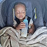 Eric joined the competition — help win amazing prizes! baby, sleeping, car_seat, bottle, milk, blanket, infant, child, portrait, indoors, seated, harness, cozy, nap, face, closed_eyes, feeding, gray, textile, photography