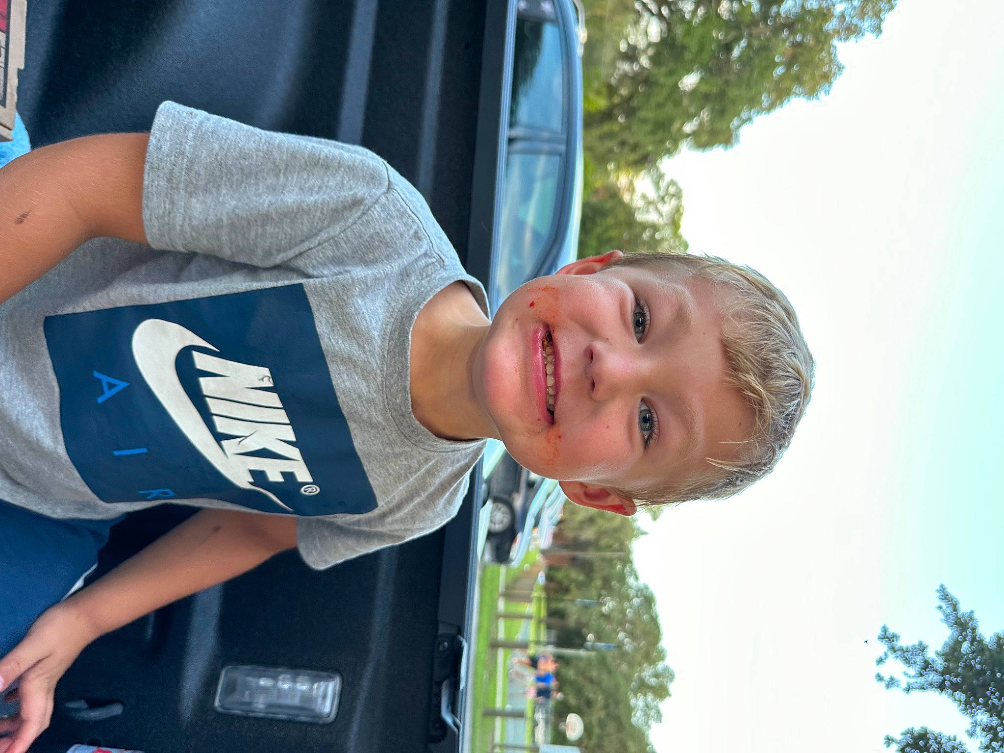 Maxton joined the competition — help win amazing prizes! automotive_exterior, car, elbow, electric_blue, family_car, fun, happy, hat, joy, leisure, light, motor_vehicle, person, plant, recreation, sky, smile, sportswear, t_shirt, travel