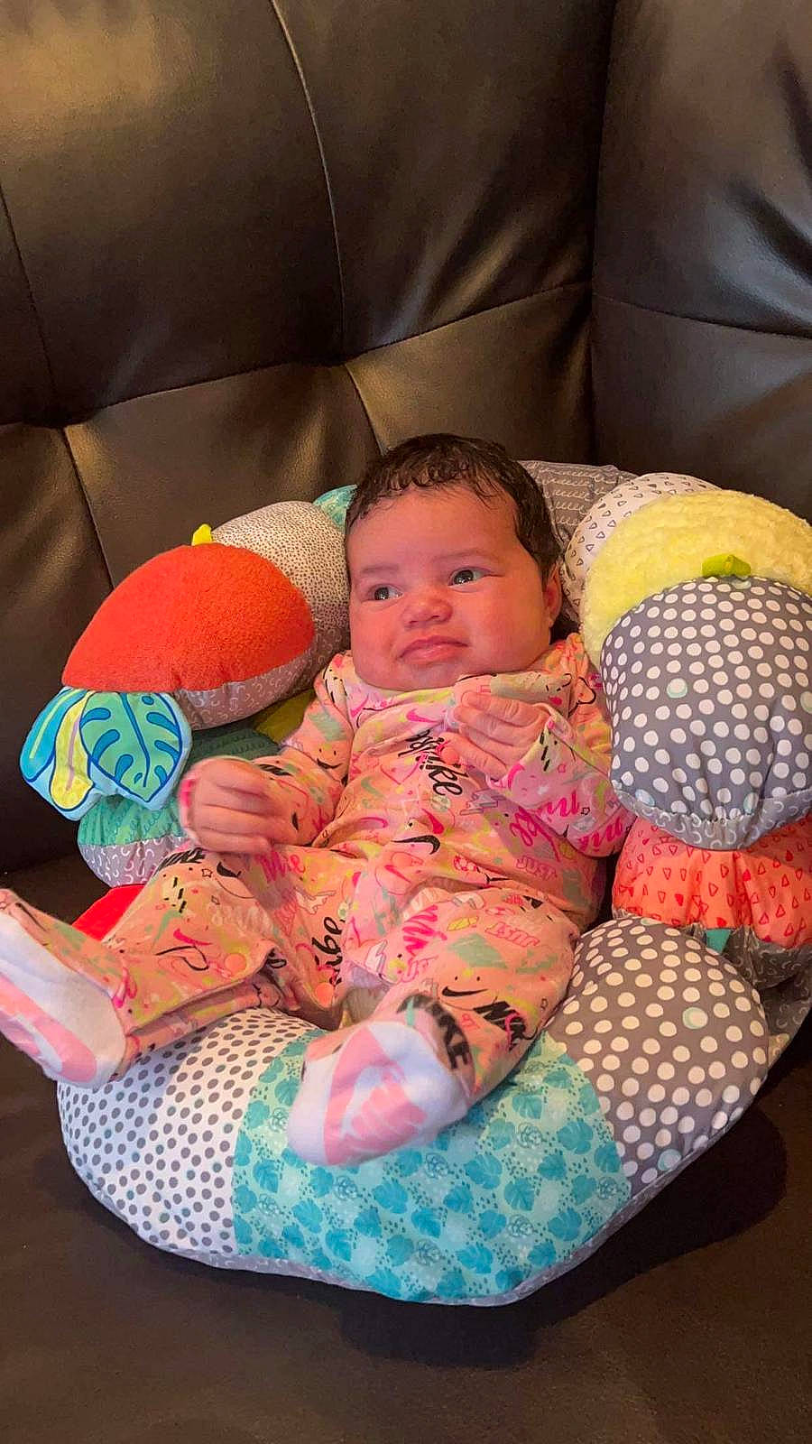 Samaya is registered to the contest to win money with this photo: baby, baby_products, baby_sleeping, baby_toddler_clothing, cheek, child, comfort, facial_expression, finger, hairstyle, human_body, lap, linens, mammal, person, product, room, sitting, skin, textile