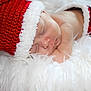 baby, newborn, sleeping, red_hat, knitted_hat, white_fur, cozy, holiday, christmas, cute, infant, soft_texture, portrait, peaceful, resting, skin, wrapped, closeup, child, festive