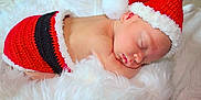 Rowan joined the competition — help win amazing prizes! newborn, baby, sleeping, santa_hat, red, black, knitwear, blanket, fluffy, cute, holiday, christmas, infant, resting, soft, cozy, skin, head, peaceful, portrait