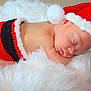 newborn, baby, sleeping, santa_hat, red, black, knitwear, blanket, fluffy, cute, holiday, christmas, infant, resting, soft, cozy, skin, head, peaceful, portrait