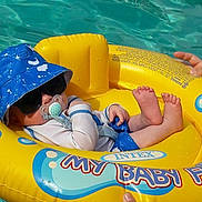 Lucas is registered to the contest to win money with this photo: amusement_park, games, inflatable, leisure, play, recreation, swimming_pool, water_park