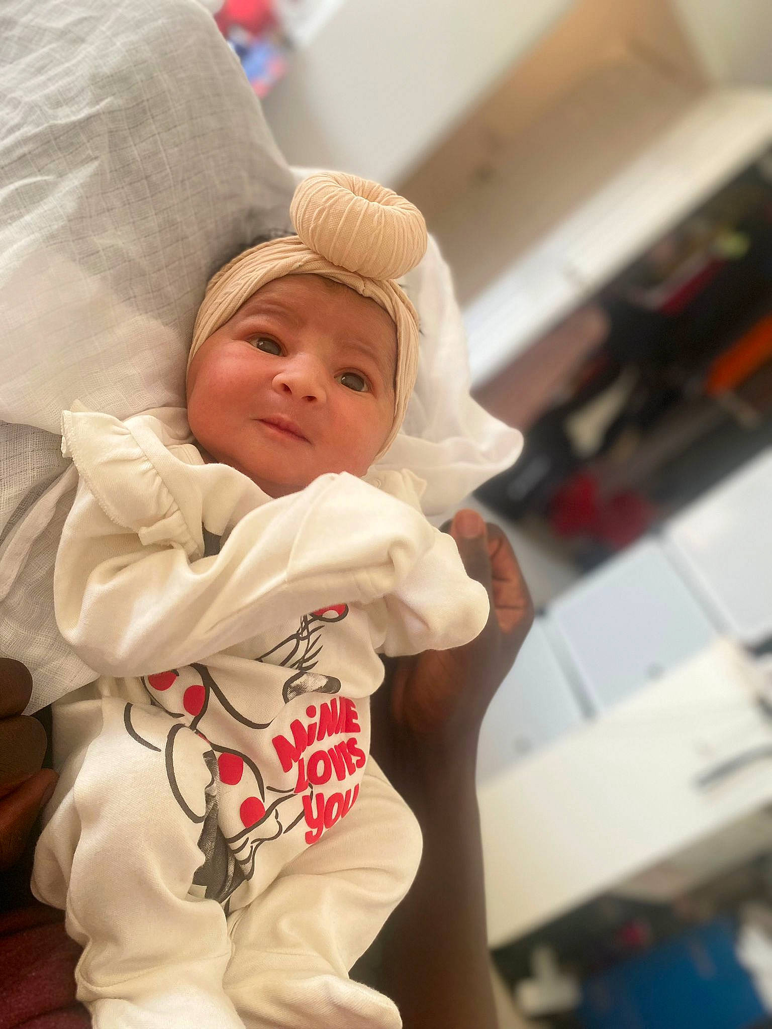 Maria-valentina is registered to the contest to win money with this photo: baby, baby_products, baby_sleeping, baby_toddler_clothing, cap, child, comfort, event, fur, happy, headwear, linens, person, room, sitting, sleeve, smile, toddler