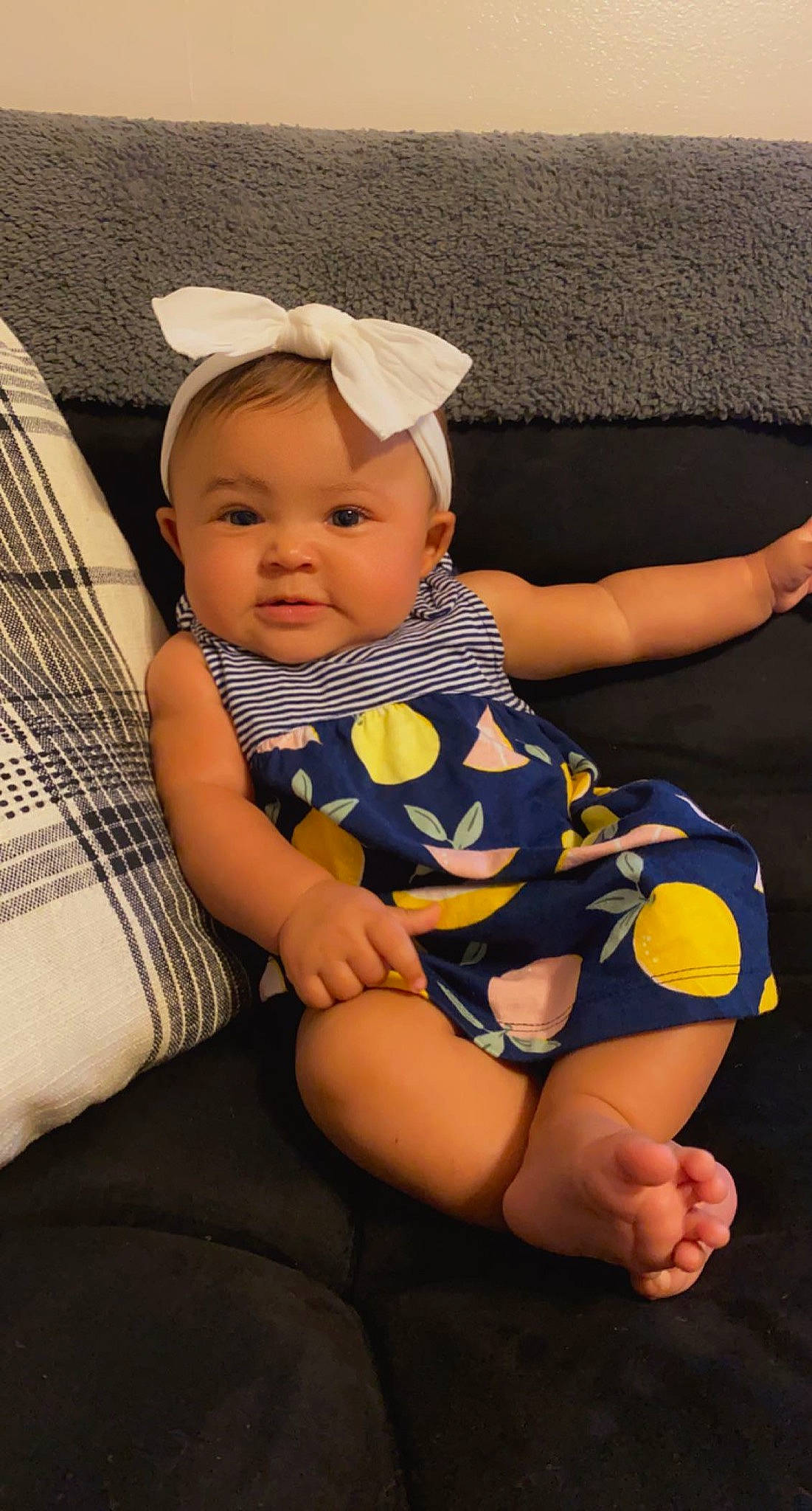 Talia joined the competition — help win amazing prizes! baby, baby_products, baby_toddler_clothing, cap, child, comfort, electric_blue, fashion_accessory, foot, fun, human_leg, knee, lap, nail, pattern, person, sitting, skin, sock, thigh