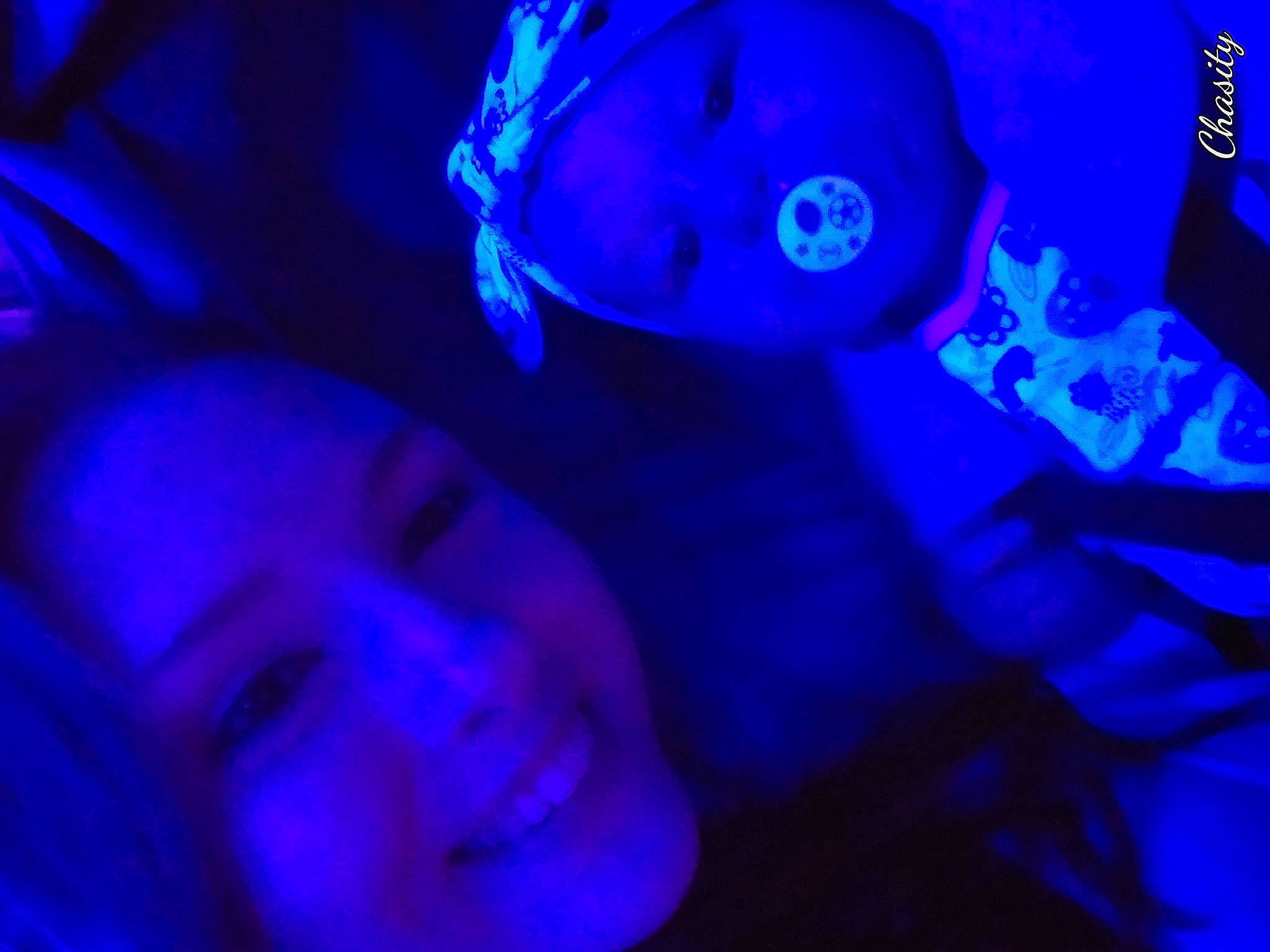 Edith is registered to the contest to win money with this photo: blue, cnidaria, cobalt_blue, electric_blue, joy, light, magenta, nightclub, organism, person, purple, under_exposed, violet