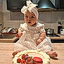 appliance, baby, cake, child, cooking, countertop, cute, dessert, food, foot, frosting, headband, indoor, kitchen, macaron, portrait, pots, sink, strawberries, white_dress