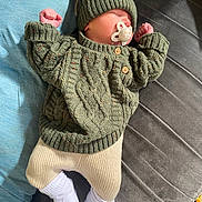 Darwin-James is registered to the contest to win money with this photo: baby, casual, child, clothing, cozy, cute, hat, indoor, infant, knitwear, newborn, pacifier, peaceful, portrait, relaxing, resting, sleeping, soft_surface, warm, white_socks