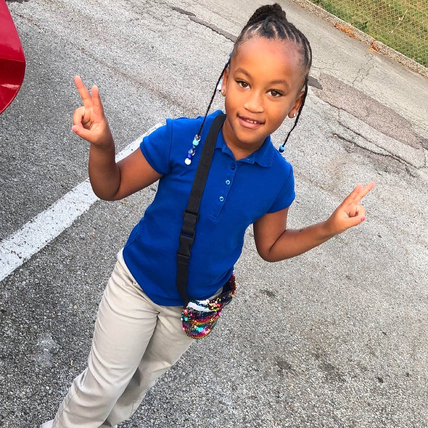 Lauryn joined the competition — help win amazing prizes! asphalt, blue, child, cool, facial_expression, finger, fun, gesture, hand, happy, head, jeans, joy, people, person, photography, play, public_space, smile, summer