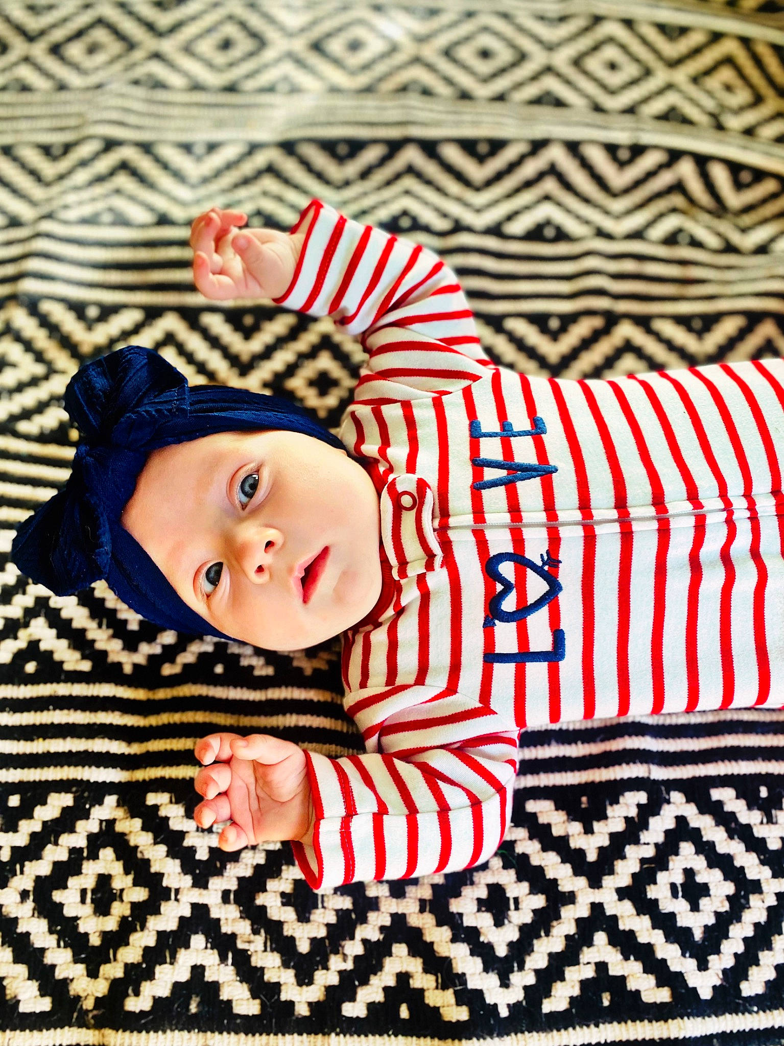 Auriyah joined the competition — help win amazing prizes! art, baby, baby_products, baby_toddler_clothing, child, costume_hat, happy, hat, headgear, headwear, linens, magenta, pattern, person, rectangle, sleeve, smile, textile, toddler