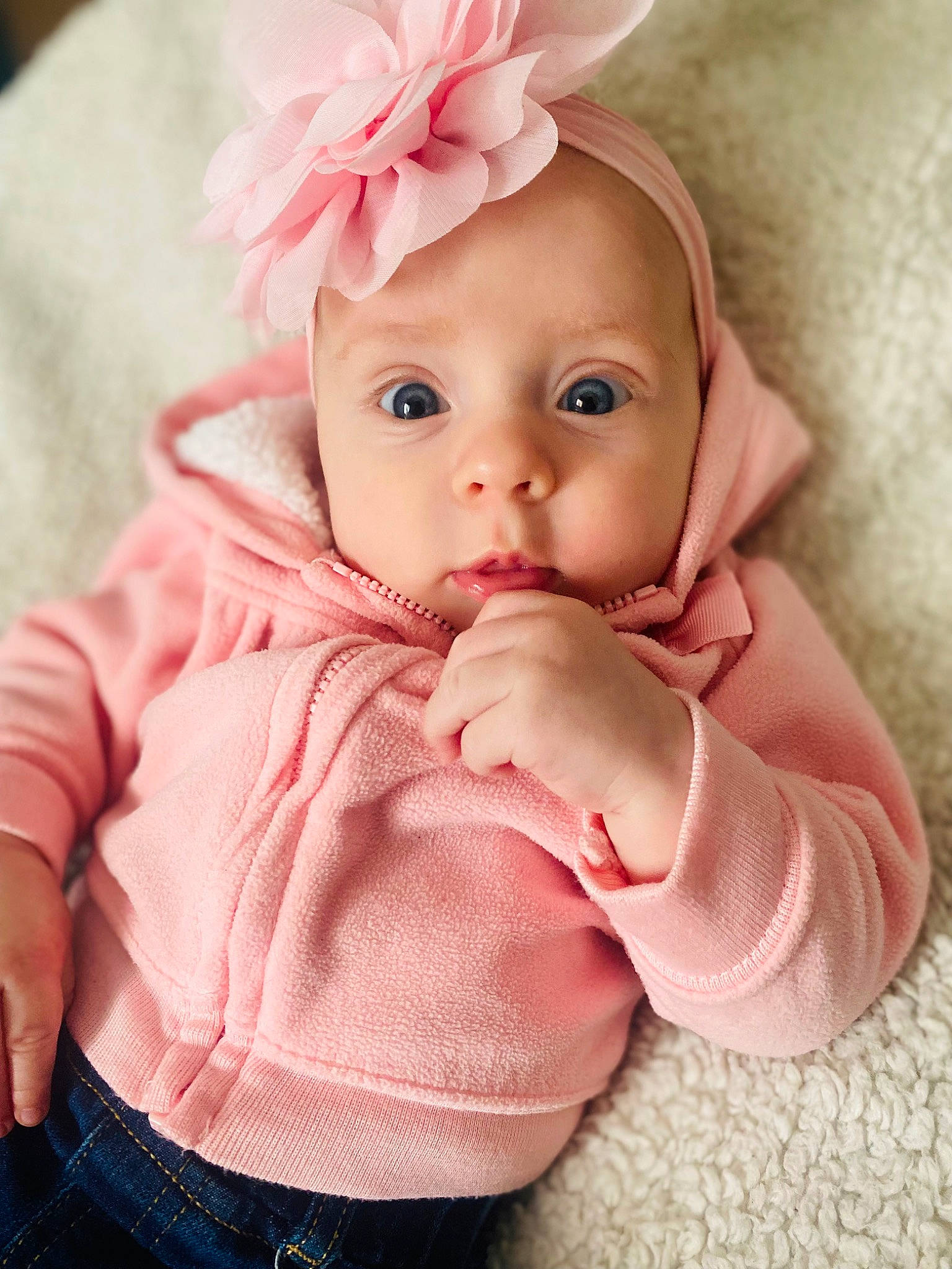 Auriyah joined the competition — help win amazing prizes! baby, baby_toddler_clothing, cap, cheek, chin, comfort, facial_expression, finger, flower, happy, headgear, headwear, lip, magenta, nose, person, petal, pink, skin, sleeve