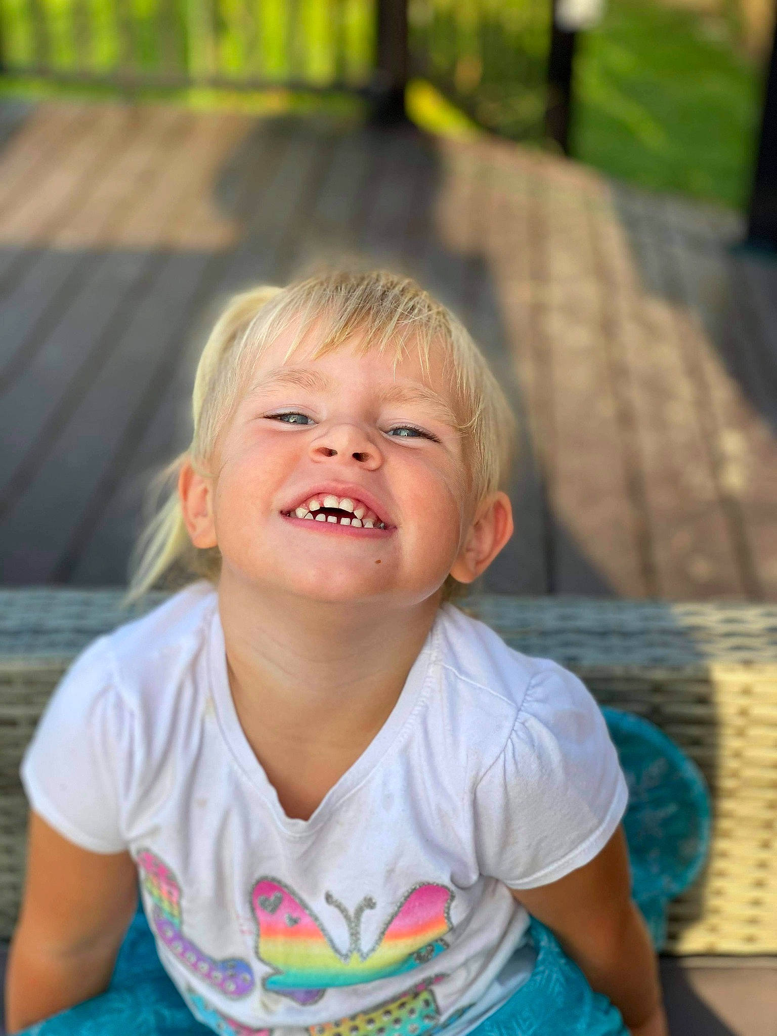 Victoria is registered to the contest to win money with this photo: blond, child, chin, eye, face, facial_expression, fun, grass, happy, head, iris, joy, laugh, leisure, nose, people, person, skin, smile, summer