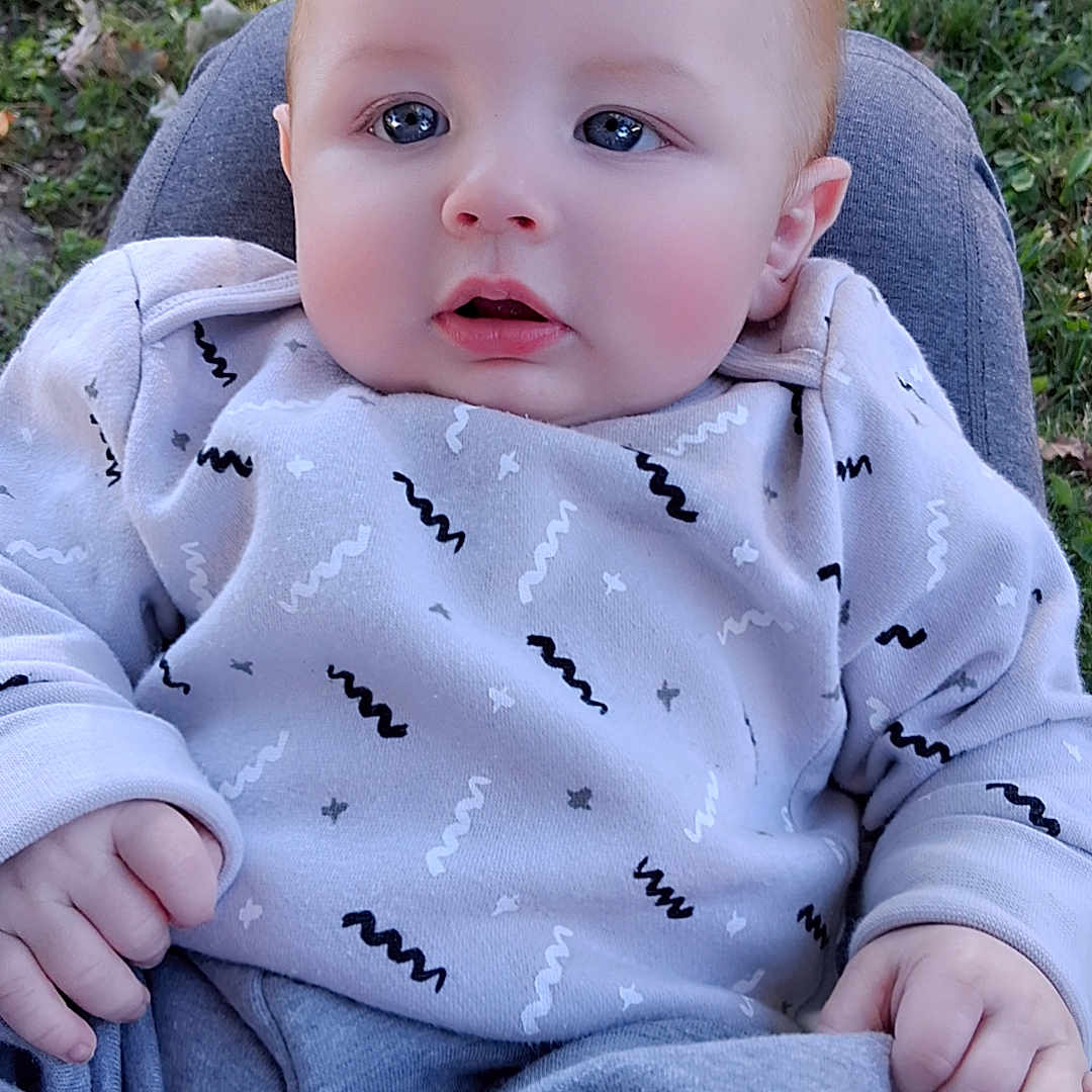 Briar Moon joined the competition — help win amazing prizes! baby, casual, child, clothing, cozy, cute, expression, eyes, face, grass, hands, head, infant, nature, outdoor, person, portrait, sitting, warm, young