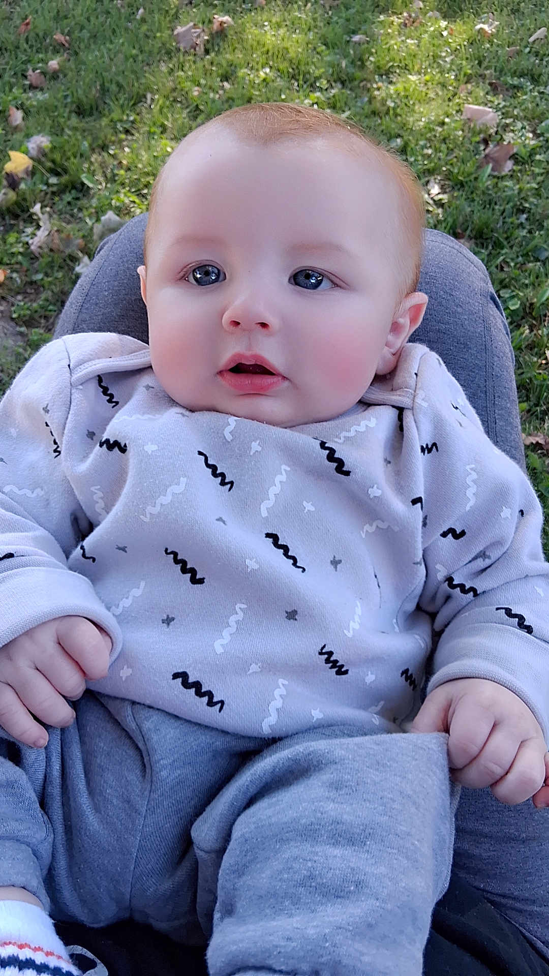 Briar Moon joined the competition — help win amazing prizes! baby, child, infant, outdoor, grass, clothing, sitting, cute, face, hands, eyes, head, person, young, casual, nature, portrait, expression, warm, cozy