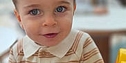 Livio participe au concours pour gagner de l'argent avec cette photo : baby, blue_eyes, child, clothing, curious, cute, face, hands, happy, indoor, person, playful, portrait, seat_belt, short_hair, smiling, striped_sweater, toddler, toy_car, young_child