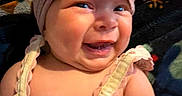 Averi is registered to the contest to win money with this photo: apparel, baby, cheerful, child, closeup, cute, dress, face, happy, headband, indoors, infant, person, plush, portrait, sitting, skin, smile, warm, young_child