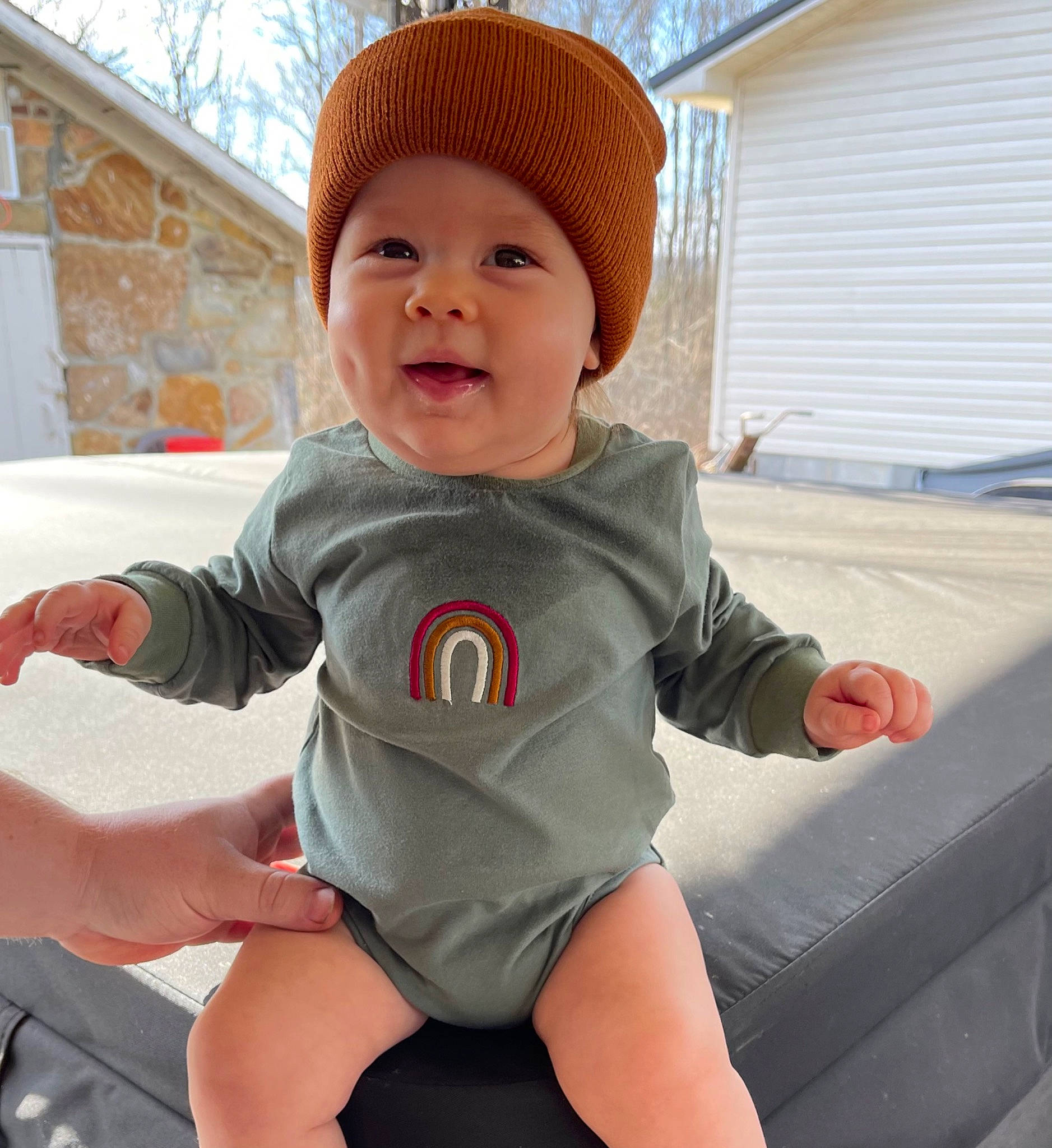 Miller is registered to the contest to win money with this photo: baby, baby_toddler_clothing, cap, cool, eye, face, facial_expression, fun, head, headwear, human_body, leg, mouth, outerwear, person, shorts, skin, sleeve, smile, t_shirt
