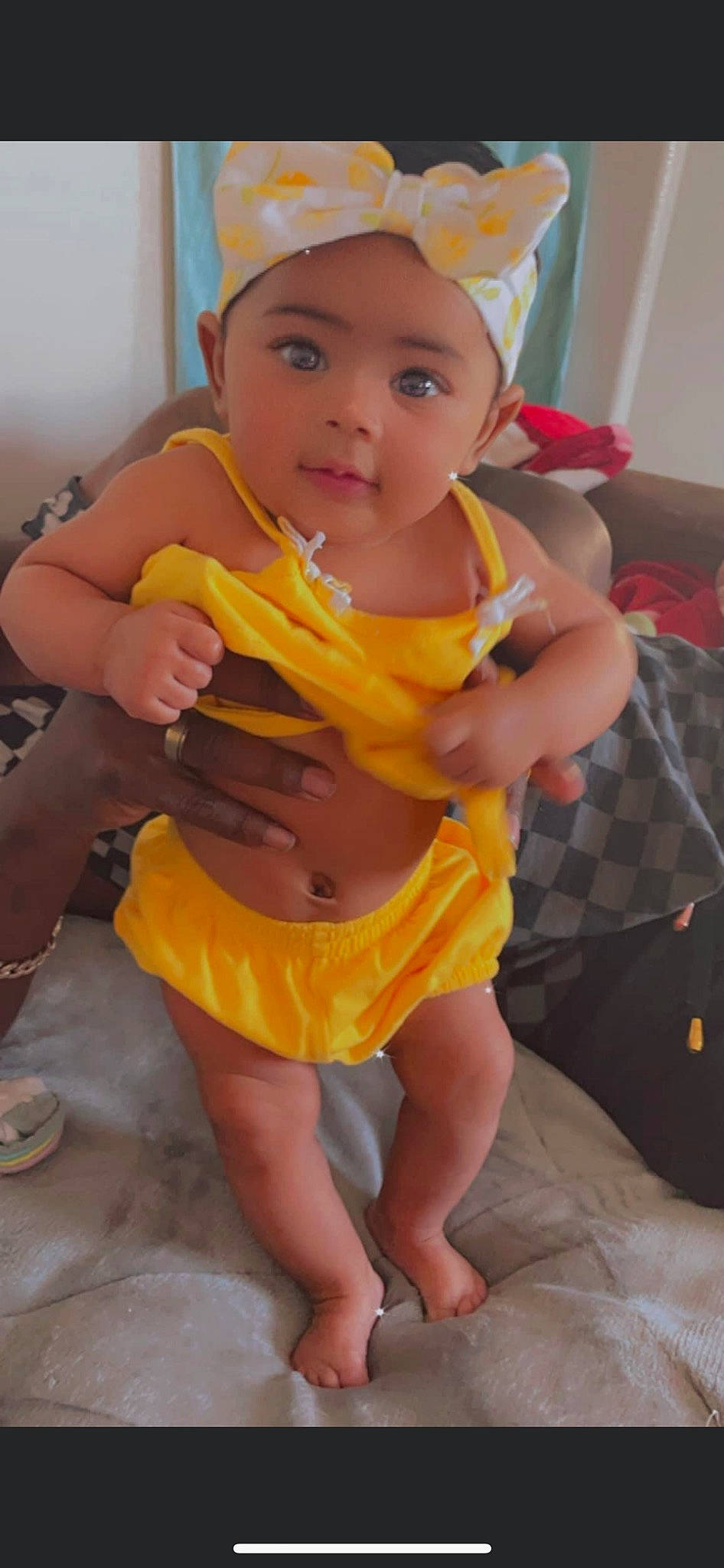 A'Mirah is registered to the contest to win money with this photo: abdomen, baby, baby_toddler_clothing, cap, child, eye, fashion_accessory, finger, foot, fun, happy, headwear, human_leg, nail, person, personal_protective_equipment, sitting, skin, thigh, thumb