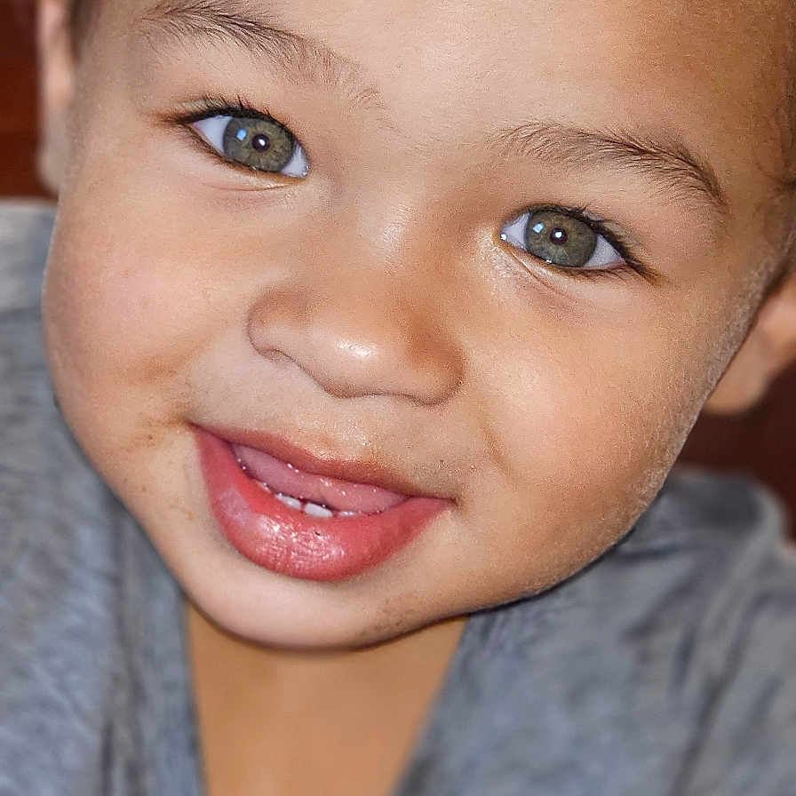 Kingstyn joined the competition — help win amazing prizes! child, close_up, clothing, curly_hair, cute, expression, face, green_eyes, grey_shirt, happy, indoor, mouth, person, playful, portrait, skin, smile, teeth, toddler, young