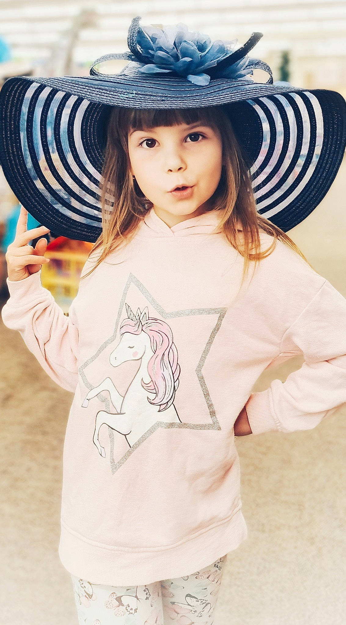 Alisa is registered to the contest to win money with this photo: bangs, child, cool, costume_hat, electric_blue, facial_expression, fashion, fashion_accessory, flash_photography, happy, hat, headgear, helmet, neck, pattern, person, sleeve, sun_hat, t_shirt, toddler