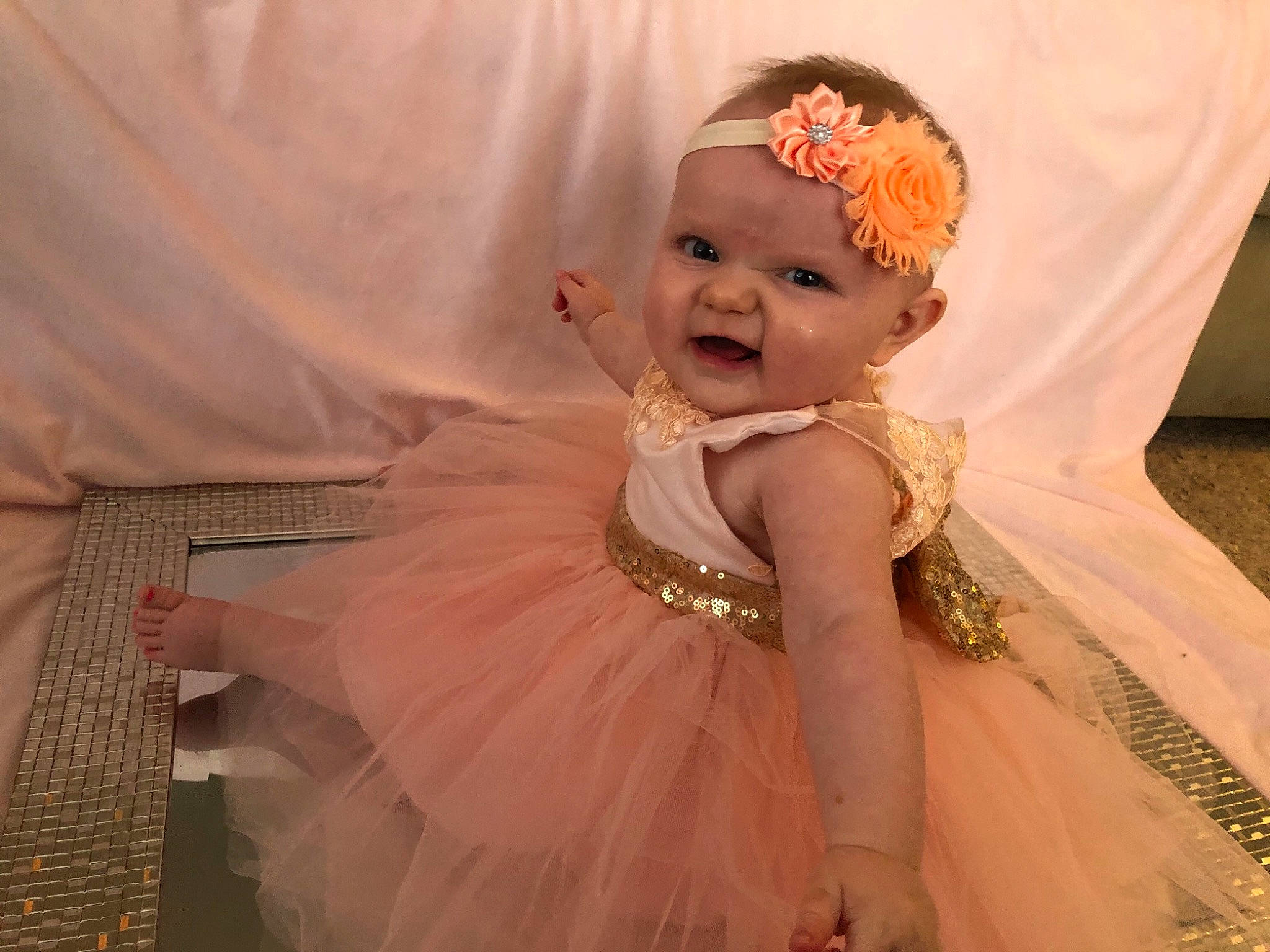 Chelsea joined the competition — help win amazing prizes! baby, baby_toddler_clothing, bridal_accessory, bridal_clothing, dress, embellishment, event, fashion_design, gown, happy, headgear, headpiece, headwear, human_body, iris, jewellery, person, pink, skin, smile