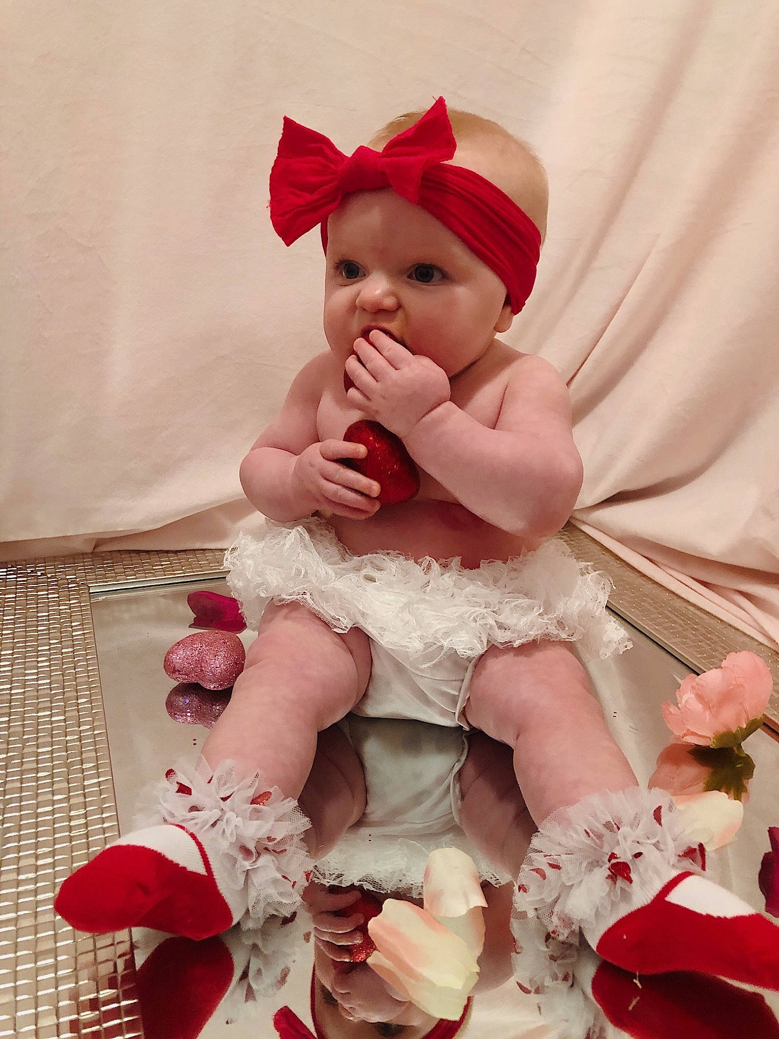 Chelsea joined the competition — help win amazing prizes! baby, baby_toddler_clothing, child, costume_hat, dress, embellishment, hair_accessory, hat, headband, headpiece, headwear, leg, magenta, mythical_creature, peach, person, petal, pink, ruffle, sleeve