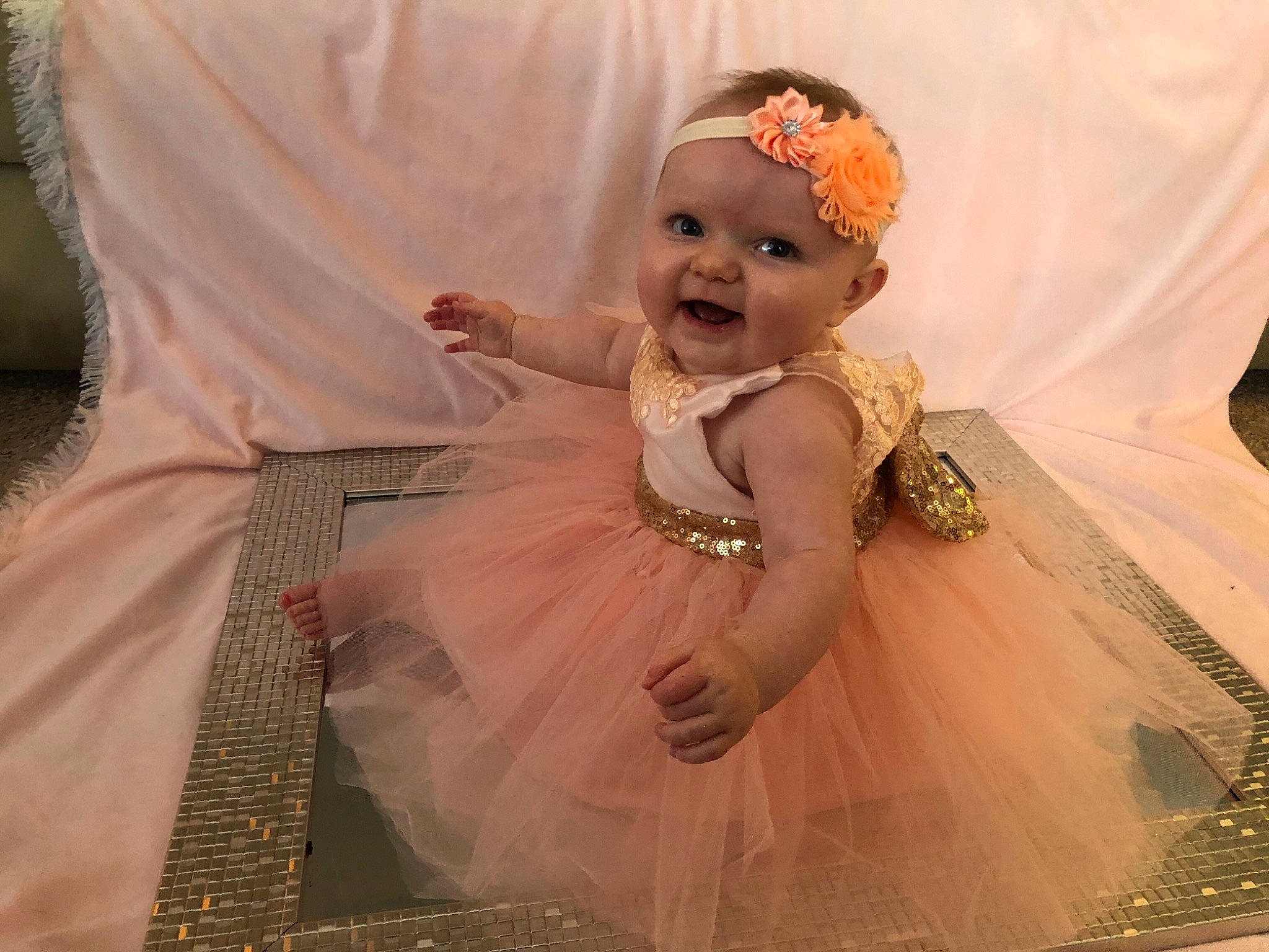 Chelsea joined the competition — help win amazing prizes! baby, baby_toddler_clothing, bridal_accessory, dress, embellishment, event, fashion_design, formal_wear, gown, happy, headgear, headpiece, headwear, human_body, iris, jewellery, person, pink, skin, smile