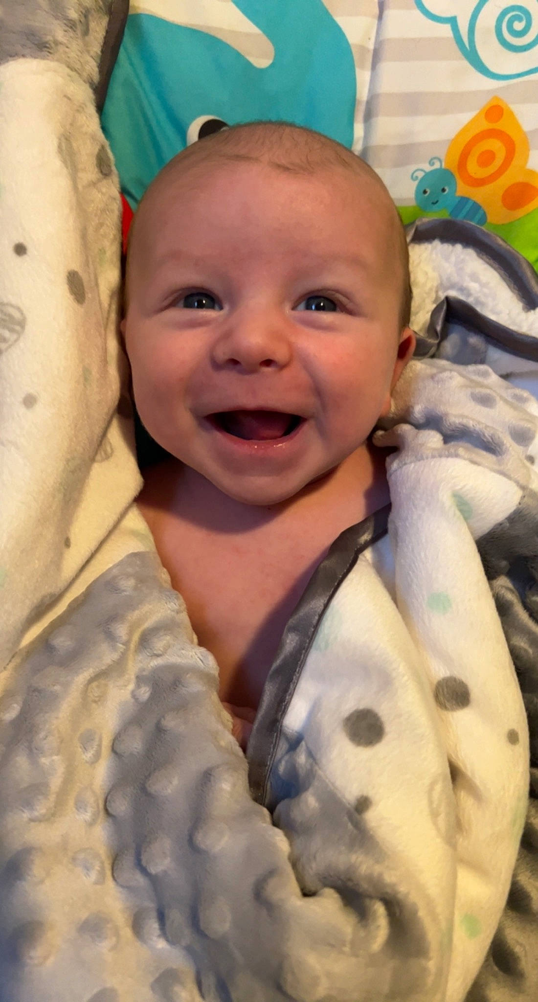 Bently joined the competition — help win amazing prizes! baby, baby_laughing, baby_products, baby_toddler_clothing, cheek, child, comfort, facial_expression, fun, gesture, happy, mouth, nose, pattern, people, person, skin, sleeve, smile, textile
