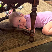 Miracle joined the competition — help win amazing prizes! child, girl, toddler, smiling, portrait, lying_down, under_table, wooden_table, ornate_furniture, carpet, indoor, playroom, play_tunnel, colorful, picture_book, toy, pink_shirt, blonde_hair, happy, candid_photo