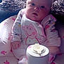 Nevaeh is registered to the contest to win money with this photo: baby, child, infant, pink, cushion, peppa_pig, clothing, face, sitting, container, lid, hand, furniture, indoors, soft_light, curious, cute, plush, toy, portrait