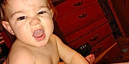Colton joined the competition — help win amazing prizes! arm, baby, bed, child, dresser, expression, face, foot, furniture, hair, hand, indoor, mouth_open, nose, object, person, phone_case, room, skin, toddler