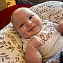 Bradley joined the competition — help win amazing prizes! baby, smile, infant, cushion, blanket, clothing, love, face, hand, cheeks, pattern, fabric, indoor, portrait, cute, child, happy, resting, cozy, soft