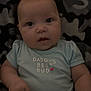 Bradley is registered to the contest to win money with this photo: baby, infant, child, onesie, blanket, face, eyes, hand, clothing, cute, portrait, indoor, soft, expression, lying_down, person, newborn, young_child, snuggled, cozy
