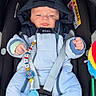 Sohan a rejoint le concours — aidez-le/la à gagner de superbes lots ! baby, infant, car_seat, snowsuit, blue_clothing, pacifier, toy, hood, straps, pout, face, child, infant_clothing, safety, outdoor, person, cute, bundle, warm, seat