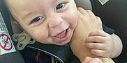 Cruz joined the competition — help win amazing prizes! baby, infant, car_seat, child, smile, happy, hands, arm, closeup, face, safety, seatbelt, pacifier, cute, person, young, childhood, playful, secure, bonding