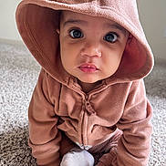 Milo joined the competition — help win amazing prizes! baby, child, hoodie, pink, carpet, sock, hand, face, eyes, infant, cute, indoors, portrait, sitting, clothing, young, expression, cozy, warm, curious