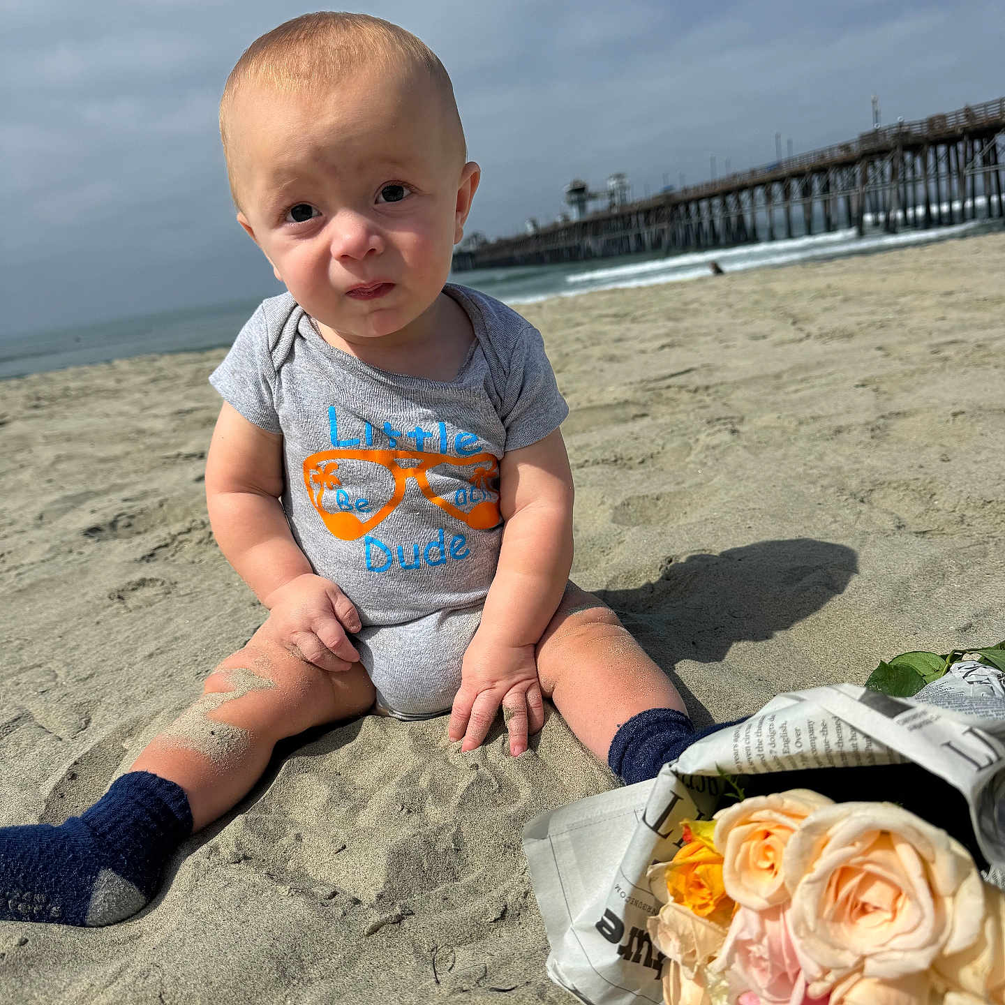 Grayson joined the competition — help win amazing prizes! baby, clothing, face, flower, flowerarrangement, flowerbouquet, head, hosiery, pants, person, petal, photography, pier, plant, portrait, rose, sock, soil, water, waterfront
