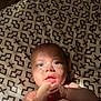baby, infant, face, blue_eyes, hands, light, shadow, blanket, pattern, skin, cute, lying_down, indoors, expression, portrait, child, soft_light, closeup, young, human