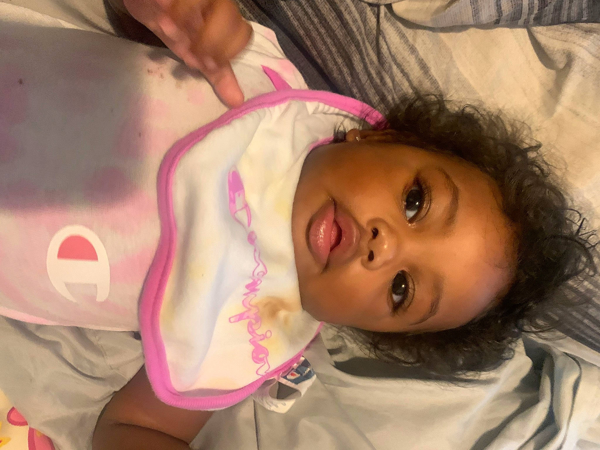 Aleia is registered to the contest to win money with this photo: baby, black_hair, cheek, chin, eye, eyebrow, eyelash, face, happy, head, human_body, iris, lip, mouth, neck, nose, person, pink, skin, textile