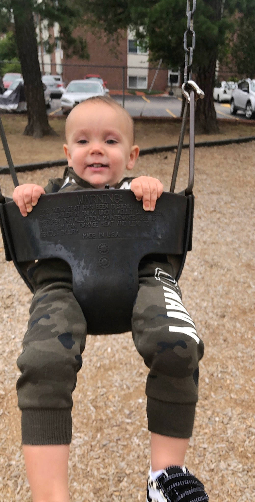 Cole joined the competition — help win amazing prizes! baby, child, outdoor_play_equipment, person, playground, swing, toddler, wetsuit