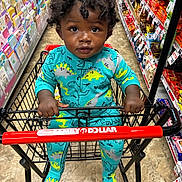 Hassan Taylor joined the competition — help win amazing prizes! baby, candy, cart_handle, child, colorful, curly_hair, dinosaur_pattern, greeting_cards, gripping, grocery_store, indoor, portrait, retail_aisle, shopping, shopping_cart, sitting, snacks, store, toddler, turquoise_clothing