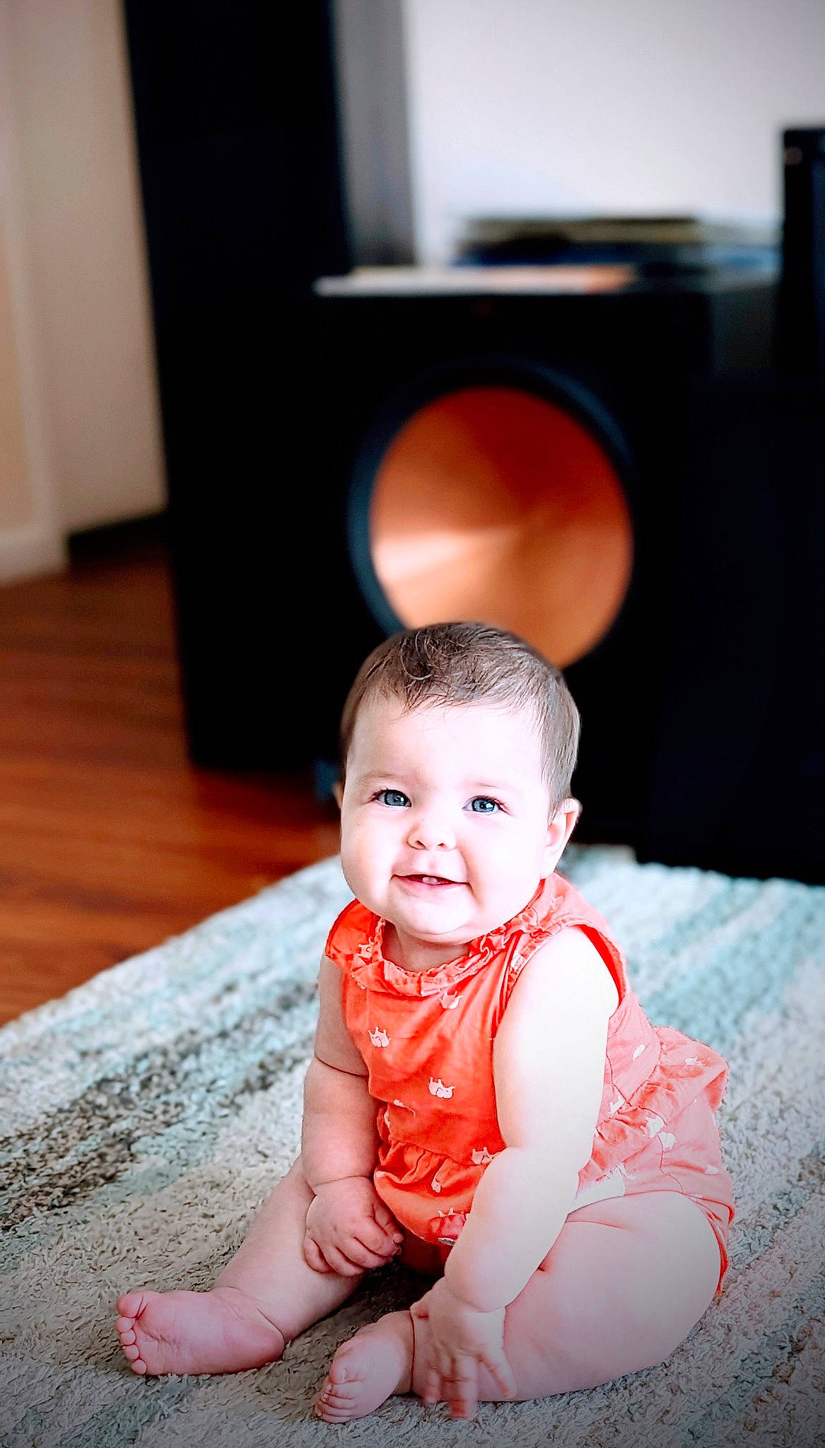 Kendra joined the competition — help win amazing prizes! baby, baby_toddler_clothing, cheek, child, chin, flash_photography, flooring, fun, happy, hardwood, laugh, person, portrait_photography, room, sitting, sleeve, smile, television, toddler, wood