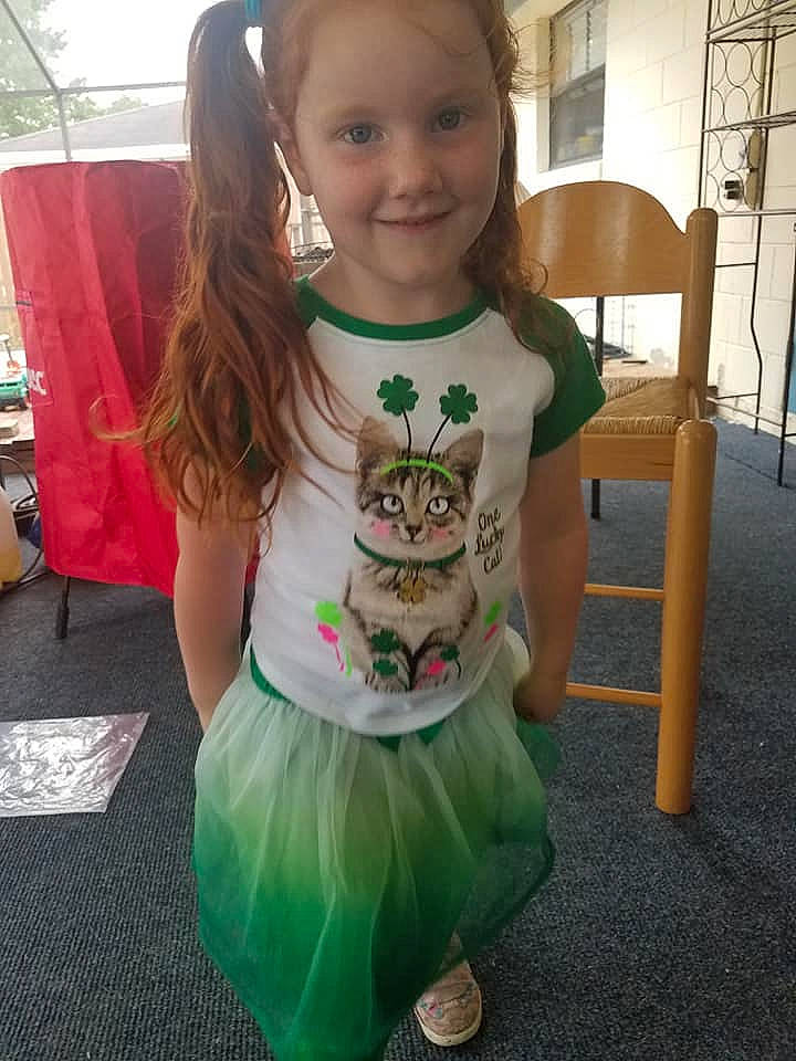 Faelyn is registered to the contest to win money with this photo: child, clothing, costume, dress, fictional_character, green, joy, person, smile, t_shirt, toddler