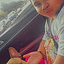Cookie is registered to the contest to win money with this photo: girl, dog, french_bulldog, car_interior, seatbelt, braided_hair, pink_clothing, hand, window, street, trees, daylight, pet, cute, portrait, casual, animal, transport, people, vehicle